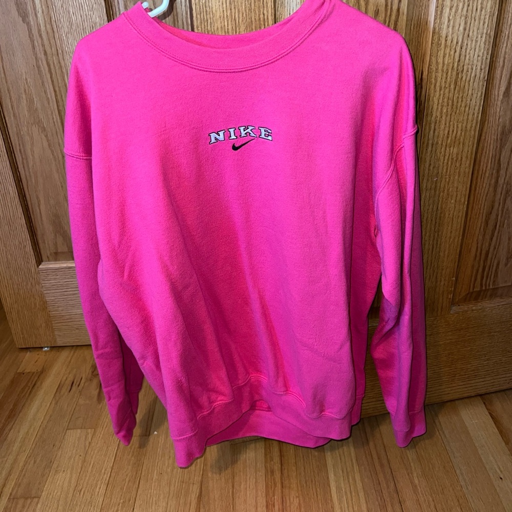 Pink “Nike” sweatshirt